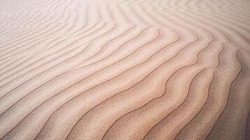 Closeup View of Wavy Desert Sand Dunes with Natural Patterned Texture and Warm Beige Tones photo