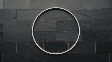 Minimalist Silver Circle Frame on Dark Slate Tile Wall in Geometric Pattern Aesthetic Design photo