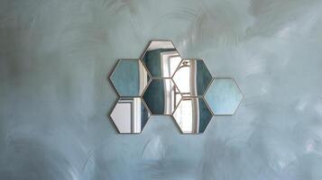 Geometric Hexagon Mirror Design on Light Blue Textured Decorative Wall with Window Reflection photo