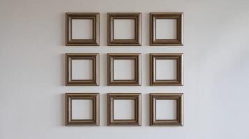 Wall Display of Nine Empty Ornate Wooden Picture Frames on Plain Neutral White Background for Interior Design photo