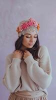 Woman Wearing Crochet Floral Headband and Beige Sweater Against Light Pastel Background photo