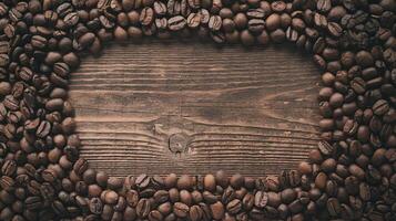 Dark Coffee Beans Frame on Rustic Wooden Table with Empty Space for Text or Design Background photo