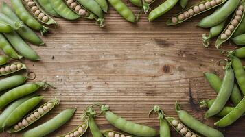 Fresh Green Peas in Opened Pods Arranged in Circular Pattern on Rustic Wooden Table Background photo