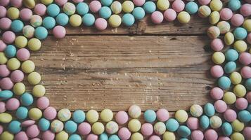 Multicolored Candy Frame on Rustic Wooden Surface with Empty Space Centered for Text or Design photo
