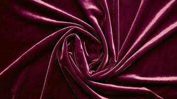 Elegant Deep Burgundy Velvet Fabric Texture with Swirling Pattern and Rich Soft Material Background photo