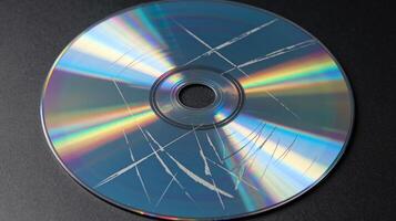 Scratched Compact Disc with Reflective Surface on Dark Background Showing Data Damage Concept photo