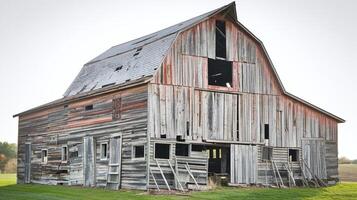 Old Weathered Wooden Barn on Green Grass Field with Rustic Texture and Open Windows in Countryside photo