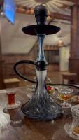 Smoking Hookah and Exhaling Smoke at a Cafe video