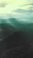 black volcanic dust and mountains with fog in background video