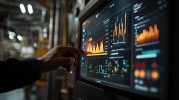 Supervisor monitoring production line using digital display in factory photo