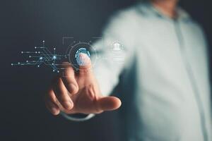 Businessman protecting personal data on finger print with virtual screen interfaces. Cyber security and privacy concepts to protect data. Lock icon and internet network security technology. photo