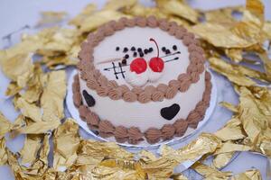 Cake with cherry on top and with a white background. photo