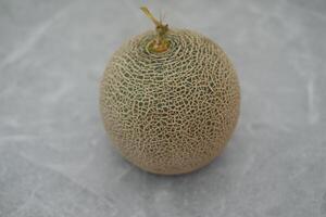 cantaloupe melon on a marble background photo