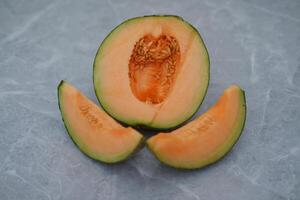 fresh melon sliced on the table photo