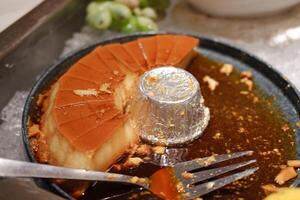 The pudding features a shiny caramel layer on top photo