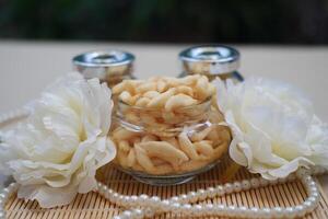 telur gabus sticks in a jar on wooden table photo