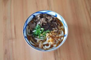 Japanese noodles with fresh meat and vegetable filling photo