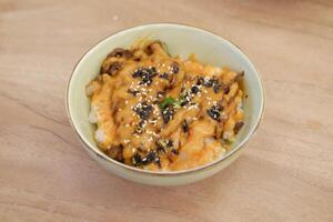Mentaiko is seasoned cod roe, known for its rich, slightly spicy, and savory flavor photo