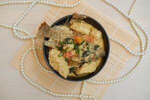 Fish curry with a super delicious combination of tempeh and tofu photo