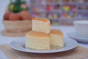 fluffy cheesecake on a white plate with beautiful decoration photo