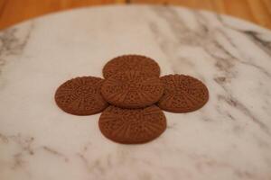 Cookies on a marble, neatly arranged photo