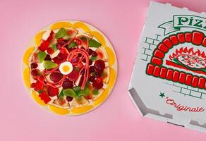 Creative layout made with colorful gummy candy mix on light pastel pink background. Minimal candy pizza concept. Trendy surreal pizza idea. Gummy candies aesthetic. Flat lay, top of view. photo