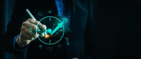 Business Professional Using Digital Pen to Illustrate Time Management and Business Growth Strategy on Virtual Interface, Displaying Analytics, Goals, and Productivity Optimization photo