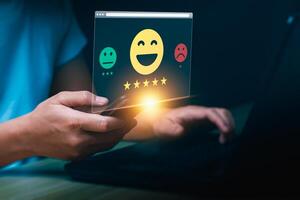 Customer Satisfaction Concept Person Using Smartphone to Leave Feedback with Positive, Neutral, Negative Emoji Options, Highlighting the Importance of Online Reviews and Ratings in Digital Business photo