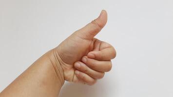 A woman thumbs up something. Communication concept isolated on white background photo