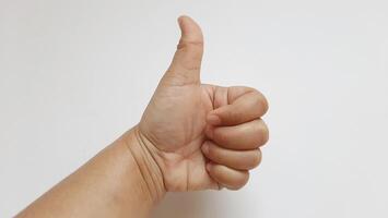 A woman thumbs up something isolated on white background photo