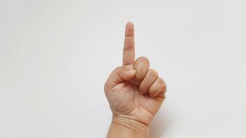 A woman hand forefinger something up photo