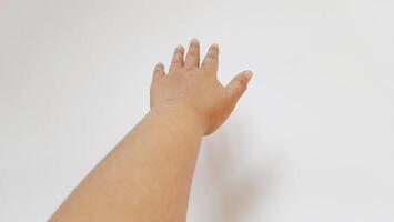 Human hand reach something. Isolated on white background photo