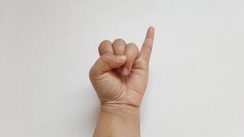 A woman hand showing little finger isolated on white background photo
