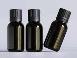 Three black bottles with different sizes of essential oils photo