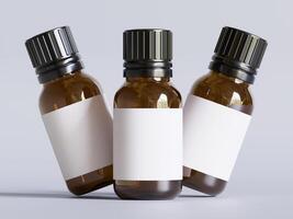 Three bottles of essential oils are shown on a white surface photo