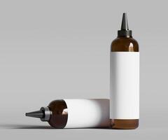 Two empty bottles of liquid on a gray background photo