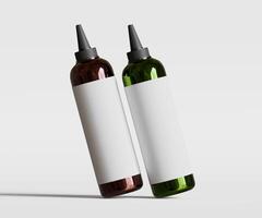 Two bottles of liquid on a white background photo