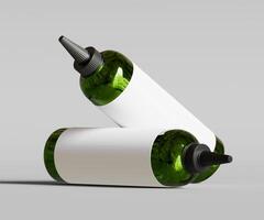 Two green bottles with white labels on a gray background photo
