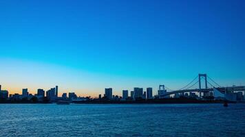 Sunset timelapse at the rainbow bridge in Odaiba Tokyo video