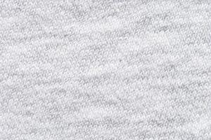 Close up of white knitted wool texture with soft fabric pattern for cozy background design. photo