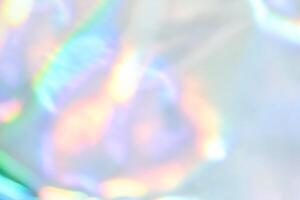 Abstract pastel holographic light blur with iridescent rainbow pattern in soft focus. photo