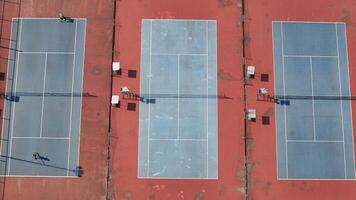 aerial view of three tennis courts. photo