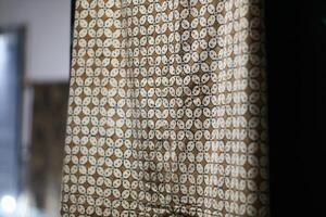 one of the typical Indonesian batik cloth motifs called the Kawung motif is being hung. photo