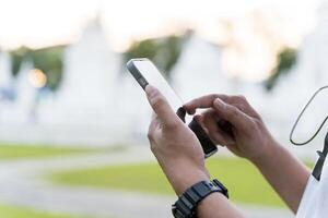 Man, hands with phone screen in city for travel, commute or navigation on transport app. photo