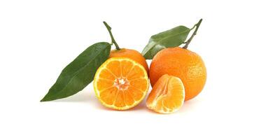 Fresh Ripe Mandarin Oranges with Leaves and Slices Displayed on White Background photo