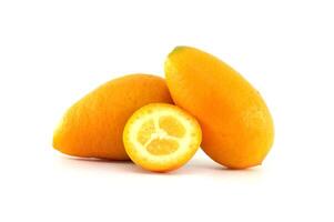 Fresh Kumquats and a Sliced Piece on a White Background photo