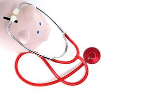 Piggy Bank With Stethoscope Symbolizing Financial Health And Security photo