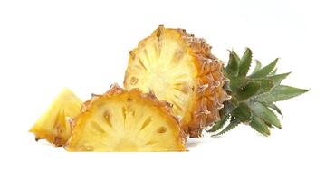 Fresh Pineapple with Slices on a White Background photo