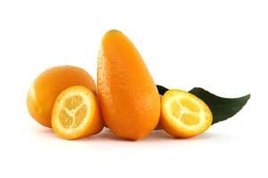 Fresh kumquats with leaf and two halves showing pulp on white background photo