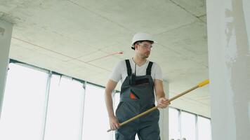 Builder Applying Wall Coating with Roller in Renovation Project video